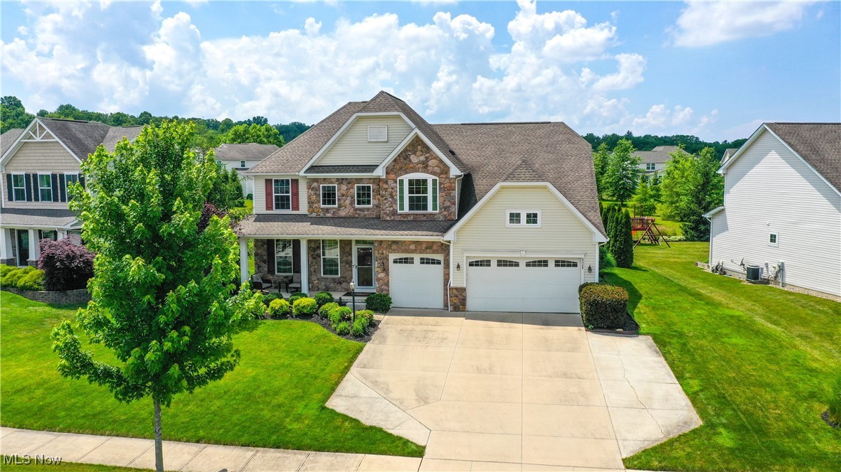 Nestled between two rural roads, this impressive custom home neighborhood offers beautiful views and a fantastic setting for this elegant two-story residence. There's no need to build when you can move right into this meticulously finished home, complete with all the desirable upgrades.
The first-floor great room seamlessly connects to a spacious kitchen featuring a large granite island and ample cabinet space. The eating area even includes a built-in beverage cooler for your convenience. From the kitchen, you can step out into the three-season sunroom and enjoy a relaxing dip in the hot tub, all of which is enclosed.
Also on the first floor, there's a guest bedroom with easy access to a full bath. The second floor boasts three additional bedrooms, a laundry area, and the luxurious owner's suite.
In the finished lower level, you'll find a space perfect for guests, complete with a full bath and an exercise room, ready for your enjoyment. The yard has small trees for privacy and a paver patio for outdoor bbq or sun.
This property truly offers so much in one home—it's a must-see!