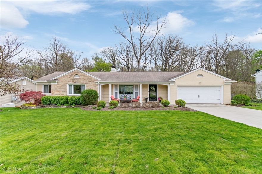 Welcome to this beautifully crafted Beres-built home in West Akron, offering serene golf course views from the front and wooded ravine views of Sand Run Metroparks from the backyard. Perfectly situated within walking distance to the Sand Run trails, this home blends character, charm, and modern updates. Inside, you’ll find rich hardwood floors, large picture windows, arched doorways, two wood-burning fireplaces, and a finished walk-out lower level! 
Step through the covered, stamped concrete patio area and into the inviting entry with distinctive flooring. 
Entertain in the spacious living room featuring an elegant, cozy fireplace and two huge picture windows which allow abundant natural light to pour in.
Host intimate dinner parties in the dainty dining room, which also boasts a large window and hardwood floors.
The dramatic, gourmet kitchen impresses with a vaulted wood ceiling, extensive KraftMade cabinetry, concrete counters, slate flooring, all appliances, wine rack, and a tile backsplash. The eating area boasts sliding doors to the deck.
Retreat to the owner’s suite with double closets, sliders to a potential balcony, and a luxurious ensuite with a walk-in shower. 
Two additional, generous-sized bedrooms and a full bathroom, with fun decor, complete the main level.
The finished walk-out lower level adds incredible living space, featuring a large family room with a fireplace, huge walk-in closet, and large picture window that could be a fourth bedroom, and a half bathroom!
Outdoor spaces include an expansive deck overlooking the professionally landscaped, .34-acre yard and stone patio 
Updates include a new air conditioner (2019), dishwasher (2019), kitchen updates (2020), painted siding (2018), new washer/dryer (2022), and more! 
This home is a true gem located in the heart of West Akron, and highlighting close proximity to all of the shopping, restaurants, expressways, and other cultural activities!