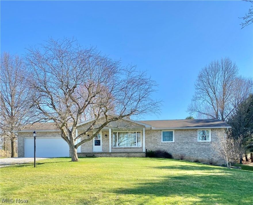Don't miss the opportunity to own this lovely 3 bedroom 1.5 bath brick ranch situated on 2 acres.  This home features a nicely appointed kitchen with beautiful maple cabinets and  breakfast bar. Refrigerator and stove remain. The  adjacent dining room has a window overlooking the large backyard and has a wonderful built-in maple china cabinet.  The living room is spacious and boasts a huge picture window looking out over the beautiful front yard and fields across the street.  There is a nice sized Master bedroom with plenty of closet space. There are 2 other bedrooms with ample closet space on the main level.  The full bath and half bath have been updated.  The lower level has a large family room with a door that walks out to the side yard.  The lower level also has a bedroom/office with a full daylight window. This home offers tons of storage space and has a 2 car attached garage as well as a 20 x 30 pole barn to the rear of the property all tools and supplies in the barn remain with