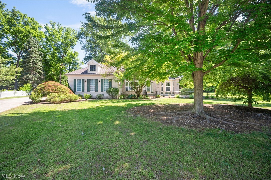 Stunning 1998 ranch situated on over an acre in Painesville Twp at the end of a cul-de-sac street. This home boasts over 2,200 square feet above grade and an additional 800 square feet finished in the basement and 1,400 unfinished square feet. The front porch also has a patio area for enjoying morning coffee. Once inside, the home has an open floorplan and vaulted foyer area. The opens to both a formal dining area with tray ceiling as well as a living room or den with bay window that faces the front of the home. The great room has high ceilings and a stunning brick, gas fireplace. The kitchen is large, has a walk-in pantry as well as both a breakfast bar and eat-in dinette with bay windows that offers a slider to the rear deck. The main floor laundry with sink and storage also includes the washer/dryer with your purchase. The home has a split floorplan that is ideal. The primary suite is light and bright, has high ceilings and his and hers walk-in closets. The primary bath has a soaking tub, dual sinks, a walk-in tiled shower and toilet room. On the other side of the home, there are two large secondary bedrooms that share a full bath. The attached oversized garage also offers an additional staircase to the basement. The basement is made for entertaining! There is a large bar and recreation area, a full bath with walk-in shower, and additional living space as well as a HUGE unfinished storage area that doubles as a workshop. Outside, the home has a deck with gas grill (with permanent gas line) that overlooks the park like lot. There are two storage sheds with plenty of space for all your equipment. The home has a small amount of frontage on Palmer Ave and is this only home on the street with city water. A home with all these features in a prime location does not come available often, so act fast and schedule a showing today!