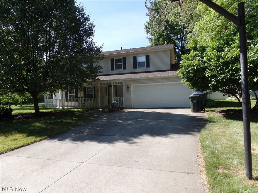 Wonderfully appointed 4 BR/2.5 BA colonial on a spacious double lot.  Many updates including solid oak kitchen cabinets, 2 pantries with pullout drawers and granite countertops! Breakfast bar, leaded glass doors on some cabinets and loads of storage and counter space. The kitchen is open to both the great room and dining room, with the laundry and half bath off the kitchen. The gas fireplace makes the great room very inviting with sliders to the fully fenced backyard. All doors are solid wood, even the closet doors. On to the upstairs with a large master, master bath and walk in closet. All bedrooms have wonderful views of nature through Pella windows. The front porch is great for relaxing and watching the world go by, while the backyard gives a lot of privacy. Other updates include, roof, bathrooms, tankless hwt, privacy fence and landscaping. Home is on a cul de sac and surrounded by trees. All this and a home warranty too. Come see for yourself!