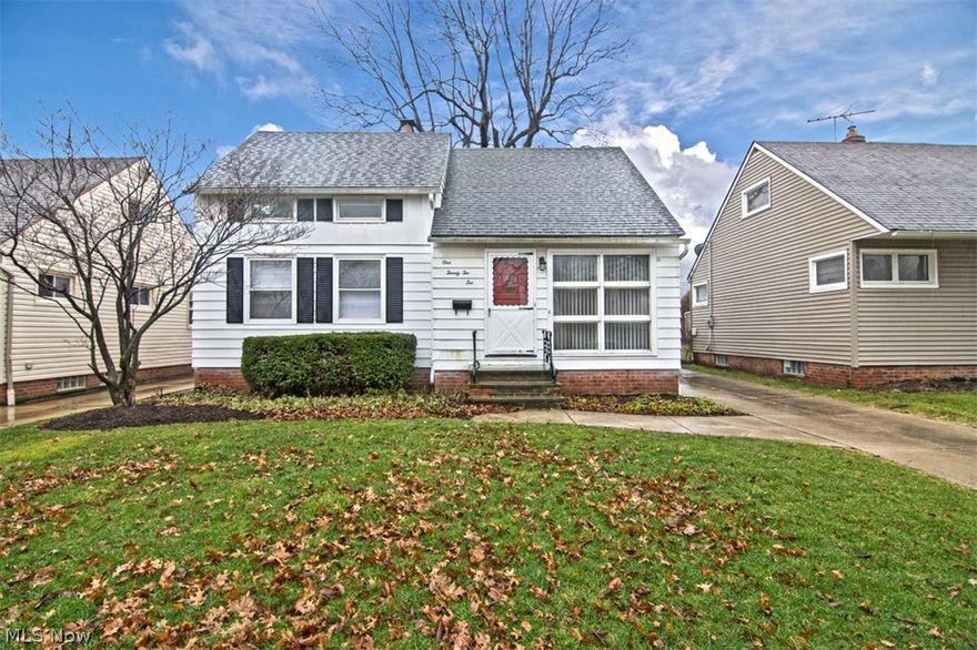 Move right in to this charming cape cod that is updated with everything you'll need to call it home! With gleaming hardwood floors throughout, a beautifully remodeled kitchen, and a private backyard and patio, all it needs is you! Step inside the spacious living room, which features a floor-to-ceiling window and lovely hardwood floors that flow into the bedrooms. The kitchen is tastefully updated with stainless steel appliances, white cabinetry and tile backsplash. Two spacious bedrooms and an updated hall bathroom complete the first floor. Upstairs, you will find two additional bedrooms with newly installed carpet. The full lower level is partially finished with a spacious rec room, perfect for a home gym! Outside, enjoy summer cookouts on the back patio, and there is a detached garage to keep cars and outdoor equipment safe. Located just off of Turney Road in Garfield Heights, this home is convenient to Garfield Park Reservation, Bedford Reservation and Astorhurst Golf Course, minute