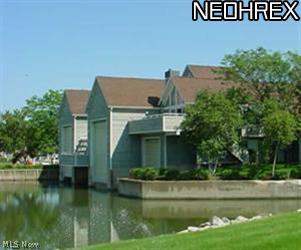 Treat your boat to the largest boathouse at the Harbour with 50' x 18' well, 40,000 lb. electric hoist, and metal sheathing ceiling to floor. Treat yourself, family and friends to the adjacent luxury living accomodations: great room with fireplace and outside deck overlooking the lagoon, spacious kitchen with custom cabinetry, sub-zero appliances, marble flooring, granite countertops and a bar area that seats six. Two large bedrooms with full bath, second floor laundry room plus third floor master suite and private bath. New roof, up-scale vinyl siding and windows. Amenities include pool, clubhouse, tennis and well-kept grounds.