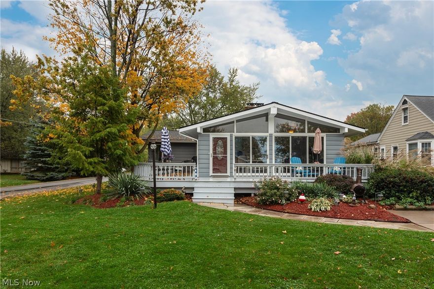 Welcome to your own Lake Erie oasis! This large corner lot is nestled in a private area and has stunning views of the lake. The home is much bigger than it appears! It has been completely renovated and will capture you as soon as you enter through the front door.The front of the house is a wall of windows that allows light to flood throughout the main areas of the home. A gorgeous stone, wood burning fireplace is a focal point of the open floor plan. The kitchen features newer stainless appliances, plenty of solid oak cabinets, and extra counter space for all of your food prepping needs. The kitchen flows into the living room which boasts stately vaulted ceilings decorated with oak beams. The rest of the house features three bedrooms, three bathrooms, and an additional living room. The master bedroom is enormous with an attached bathroom with double sinks, and a walk in closet.It also has a sliding glass door that leads to a sprawling back deck. Through the backyard, on the back of the