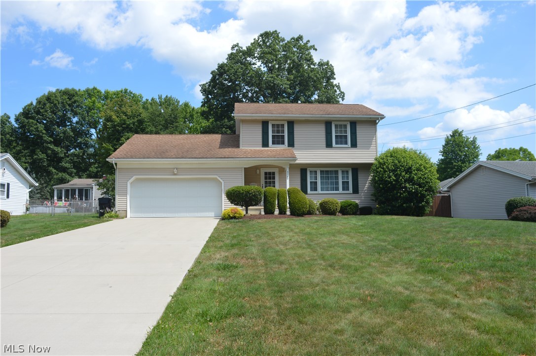 Welcome to this gorgeous 3 BR, 1-1/2 BA Colonial in Highland Park with a great floor plan! Pulling into the brand-new concrete driveway you will see a meticulously maintained home with low maintenance manicured landscaping and quaint covered front porch. Spacious living and dining room with professionally cleaned carpets and neutral paint tones. Spacious eat in kitchen with new granite counter tops and new appliances. Just coming in from work, the lay-out from the garage entrance is ideal right to the first-floor half bath and /or down to the basement staircase with a separate laundry area (washer and dryer stay) from the partially finished basement. Just through the foyer on the other end of the home, you will find a very nice sized family room with wooden beams ~ where new sliding glass doors open to an absolutely beautiful bonus sunroom with an exterior entrance (sunroom not included in sq ft). Upstairs you will find 1 large freshly painted master bedroom with natural hardwood floors. Two additional guest bedrooms with ample closet space and two linen closets for all your storage needs! The full bath is freshly painted and well maintained with a tub/shower combo. MAJOR IMPROVEMENTS ~ within the last several years include: a new roof, siding, HWT, brand new fridge, windows throughout ~ including glass block in the basement, entry door, sliding glass door, concrete drive and walkway, pebble stone garage floor coating, and you can't miss the enormous custom-built storage shed with loft, perfect for storing all of your outdoor items. Pride of ownership is evident in every corner of this home! You are sure to fall in love, so schedule your appointment before it's too late!