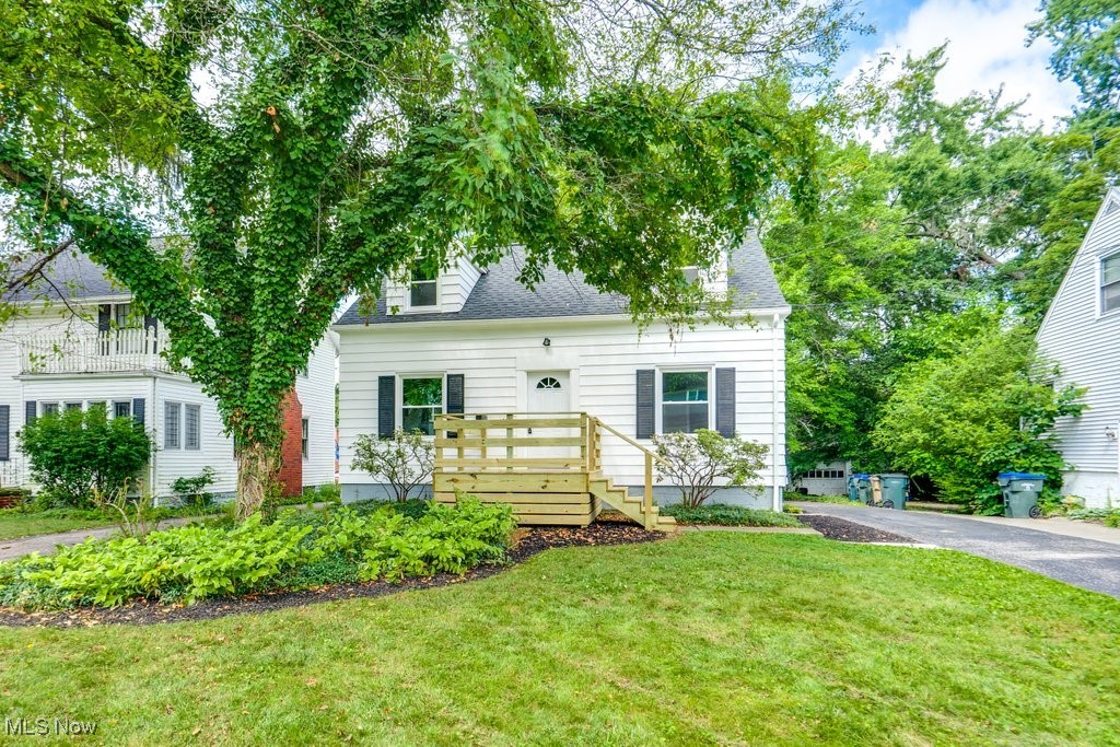 You’re going to love everything this updated Cape Cod in the heart of Cuyahoga Falls has to offer. It’s been redone from top to bottom, starting with a new roof on the house and garage, new windows, A/C, exterior doors, a rebuilt front porch, and fresh paint outside. Step inside to find all new flooring, lighting, and neutral paint that flows through the living room with a gas fireplace and shiplap surround, and into the dining area with a bayed wall of windows.
The kitchen is all new with white cabinetry, quartz counters, a tile backsplash, stainless steel appliances, and easy side-door access from the driveway. The main floor also includes the primary bedroom and a modern full bath with a tiled walk-in shower.
Upstairs are two more bedrooms with dormer windows and another beautifully updated full bath with a tub/shower combo and hallway linen storage. The lower level adds even more living space with a rec room featuring a faux fireplace, daylight window, and walk-out access to the backyard.
Enjoy two patio areas, garden beds, and a detached garage for parking and storage. All in a great location near downtown Cuyahoga Falls, with parks, shopping, dining, and highway access just minutes away. Don't miss out, call today!