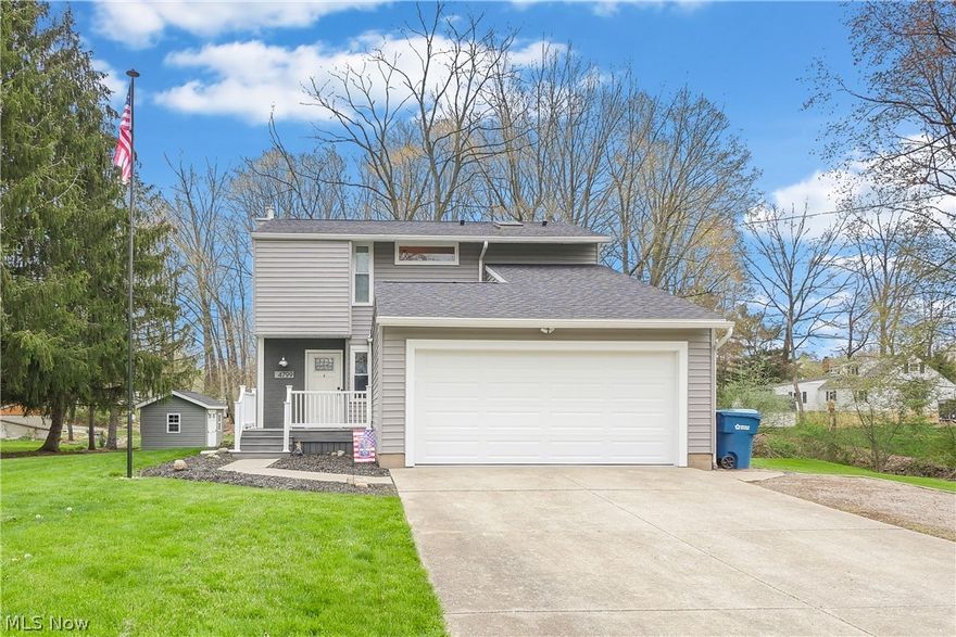 Welcome to 4799 Provens Dr, Akron, OH. This home was completely remodeled in 2017 and has had only 1 owner since! This property features 3 beds with 2.5 baths and 2,160 square feet of living space above ground and below ground finished for you or your family to enjoy! There is also almost 1 acre of land that features a creek with a bridge and woods! As you enter you will love the spacious living room with open concept to the kitchen. The living room features several large windows that bring in so much natural light with a built in wet bar and fireplace! The upstairs features 3 bedrooms and 2 full bathrooms. One being the master bedroom with master bathroom. The basement is completely finished and is the perfect media room, game room, second living room, etc. Some of the updates inside include: flooring throughout, the kitchen was completely redone, brand new cabinets, countertops, the bathrooms was completely remodeled, new vanity, tiled showered, and much more! The large back deck is