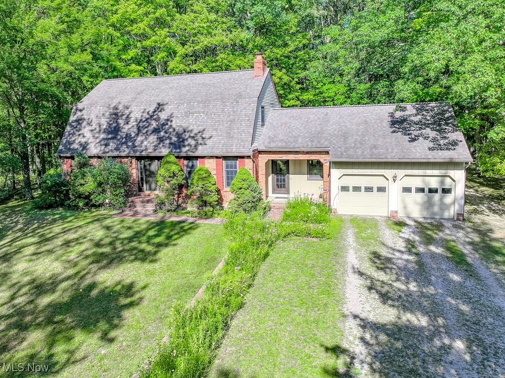 The tranquility of over 3 acres in Kirtland sets the perfect backdrop for this beautiful home. Offering 4 bedrooms and 3 full baths, this property combines comfort and convenience with thoughtful updates throughout. The first floor features a spacious living and dining room, an updated kitchen with island, a cozy family room with fireplace, a laundry room, and even a first-floor bedroom. A charming three-season room overlooks the property, providing breathtaking wooded views year-round. Upstairs, you’ll find three additional bedrooms, including a beautifully updated master suite. Two more bedrooms and a full bath complete the second floor. Nestled back among the trees, this home offers both privacy and a serene setting while still being close to all that Kirtland has to offer.