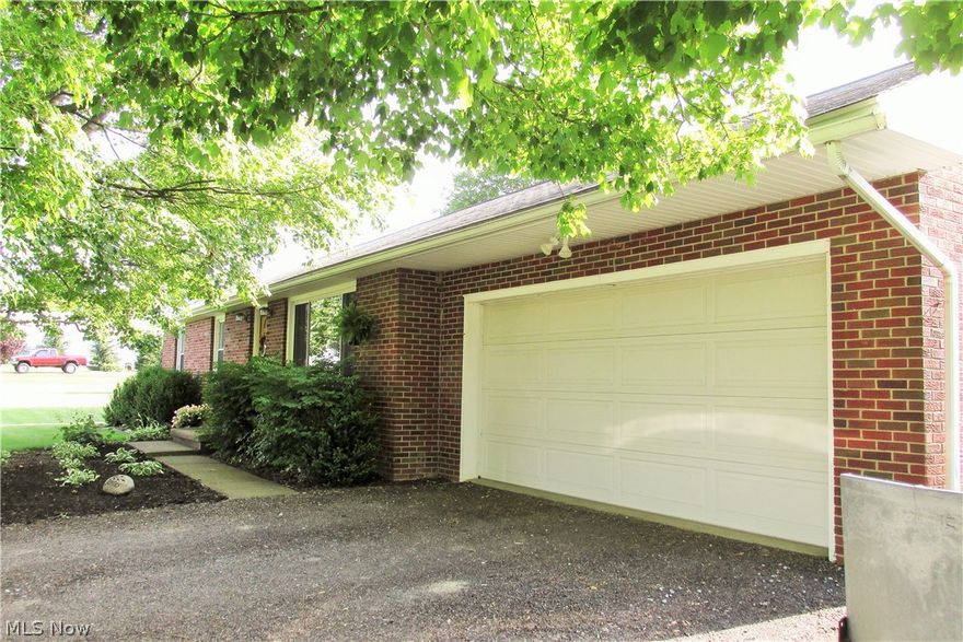 Want the convenience of country living just minutes from the city, shopping and highways?  This immaculate, move-in ready brick ranch has 3 bedrooms, 2 full baths, walkout unfinished basement (one room 10 x 11 in basement is finished and used as office space) original/refinished hardwood floors, newer windows, entry doors, overhead garage door, natural gas tankless hot water heater, updated natural gas boiler,  glass block windows, extra wide chip and seal driveway with turn-around and ample yard space for your outdoor activities. The partially fenced (vinyl privacy fence) back yard is perfect for children and/or pets and can be accessed from the kitchen or the man door in garage.