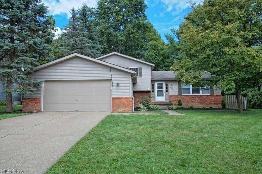 Motivated Sellers!  Very nice 3 bedroom, 2.5 bath Split Level home with partially finished basement on gorgeous wooded lot. Home features formal living room with newer laminate flooring, family room with with wood-burning fireplace and dry bar.  Additional room off family room can be converted to a first floor, 4th bedroom.  The kitchen has large center island, nice-sized pantry and tons of cabinet space. 22 x 15 deck located off on kitchen has been freshly stained.  Remodeled bathrooms, newer carpeting in family room and two spare bedrooms, newer hot water tank and many more updates.  This home is close to many amenities including a community pool, clubhouse, lake, elementary school, walking/bike trails, disc golf and are all within walking distance and is only minutes away from I-71. Beautiful picturesque wooded lot with mature trees backs up to Ewing park. This home affords a much-coveted Medina-lifestyle and is right in the heart of it all. No HOA! Home Warranty included by America