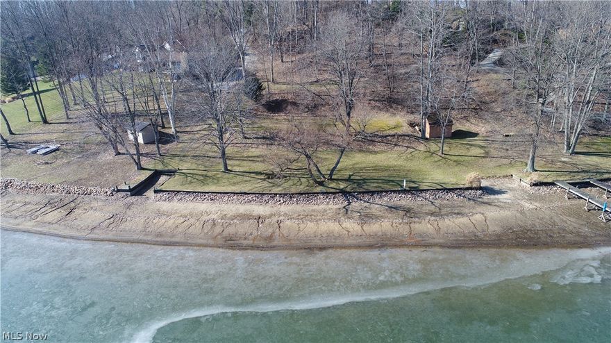 Lakefront Living! No need to buy a lot only to tear down the house and build again! Now you can build a new home from the very start on acre 1 1/2 lakefront lots with 221 feet of lake frontage. This beautiful lot is already tiered and mostly cleared. Just waiting for a house to be built. In addition, the docks, seawall plus riprap, lawn and shed are already there. You have lake access to launch your boat. The driveway is already roughed in for access to the lake. Whether you want to build or just access to the lake, this is the lot for you. Must see to appreciate.