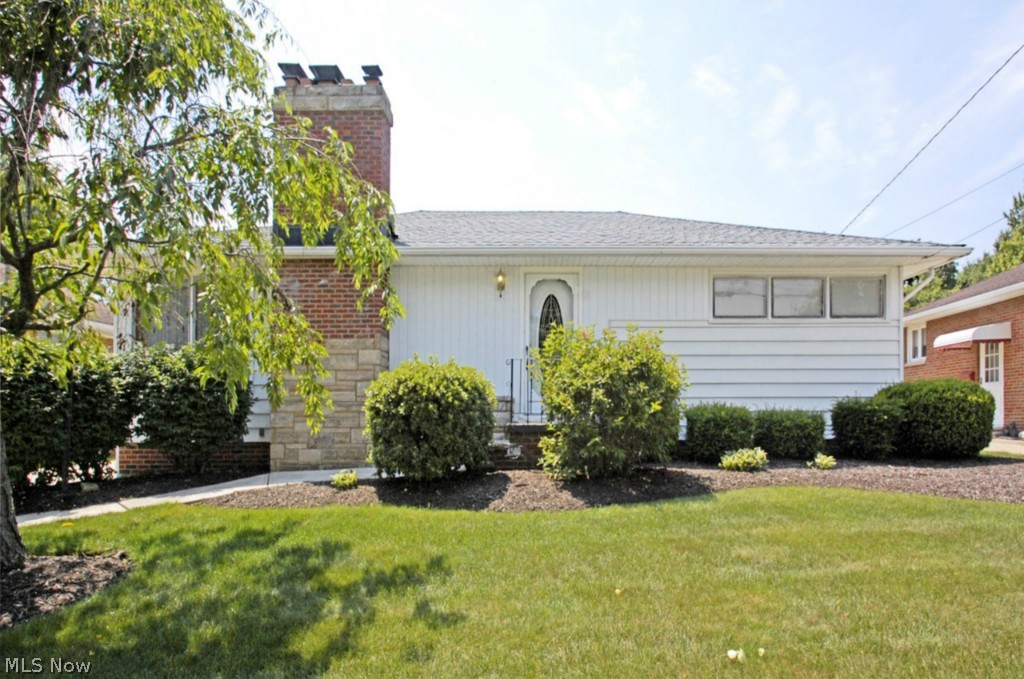 Beautiful move-in ready 3 bedroom ranch style home in pristine condition with features that you don't find every day such as pocket doors throughout, mint hardwood floors in all 3 bedrooms, natural woodwork throughout and a 1st floor family room that is absolutely gorgeous and unique to the area. The family room has a cathedral ceiling, large windows on 2 sides and a sliding door leading to a spacious custom desk overlooking the beautifully landscaped backyard, and a beautiful custom made stained glass window over the sliding door that completes the room. Also featured are a wood burning fireplace in the living room, a walk-in closet in the master bedroom, a basement with rec. room and 2nd bathroom and a 2 car detached garage with extra storage and shelves throughout. Enjoy direct access to Big Creek Parkway and the Cleveland Metroparks biking/walking/wheelchair friendly trails and picnic areas. A great deal on a truly unique property.