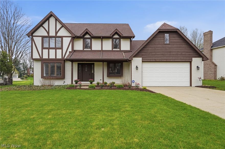 Fabulous location near the Prestwick Golf Course in Green Local Schools! This very clean Tudor-style two-story offers approximately 2,600+/- sq ft with 4 bedrooms and 2.5 bathrooms. The main level features a convenient first-floor laundry and private office. Spacious kitchen opens to a deck and stamped patio with firepit—perfect for enjoying warmer weather and entertaining. Filled with natural light throughout, this home sits in a lovely setting within a walkable neighborhood, just minutes from everyday amenities.