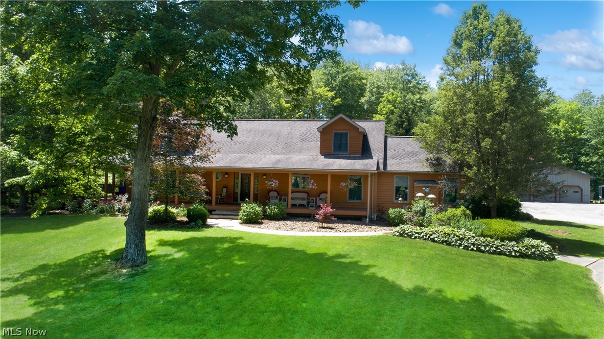 WOW! This remarkable and meticulously maintained contemporary home is beyond luxurious. This completely remodeled home is truly move in ready. Welcomed by a full front porch you come inside to a two story front foyer that leads to formal dining room with a fireplace and open to the gourmet kitchen with granite countertops, movable island, a breakfast bar, a desktop area, a high top sitting area, and appliances to please the cook of the household including a steam microwave. The great room is airy, bright and has the second fireplace. The owners suite has all you need being spacious, a beautiful private bathroom with a soaking tub, shower and dual vanity. It is also has its own private screen in porch. A spacious laundry room and 1/2 bath rounds off the first level. Upstairs you will find an open loft area perfect for an office or workout room along with the another full bath and two more bedrooms. The unfinished basement has two areas that are ready to be finished off. The 2 car heated garage is attache with a beautiful breezeway that can lead to the house or the pool area. A 90xx36 outbuilding with 4 garage doors is a dream for those looking for a shop or to hold "toys", it even has its own full bathroom. On almost 5 acres this incredible property has posh landscaping, outdoor lighting, a garden area, a tree fort for kids of all ages and a beautiful fenced in In-ground pool with a waterfall and slide coming from the rock area as well as a hot tub poolside. The pergola and patio with pavers is perfect for relaxing and enjoying the beautiful Ohio summers. Two hot water tanks and a whole house generator are a bonus. This is a must see in the Kenston School District. 1 year home warranty included.