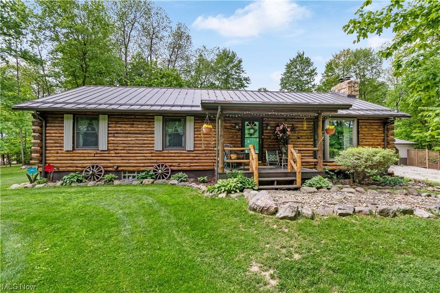 Beautiful log cabin on 4.68 acres, 3 bedrooms and 3 full baths. Meticulously cared for! The woods surrounding it make it a parklike setting, well manicured and cared for. Don't hesitate,  schedule an appointment today!