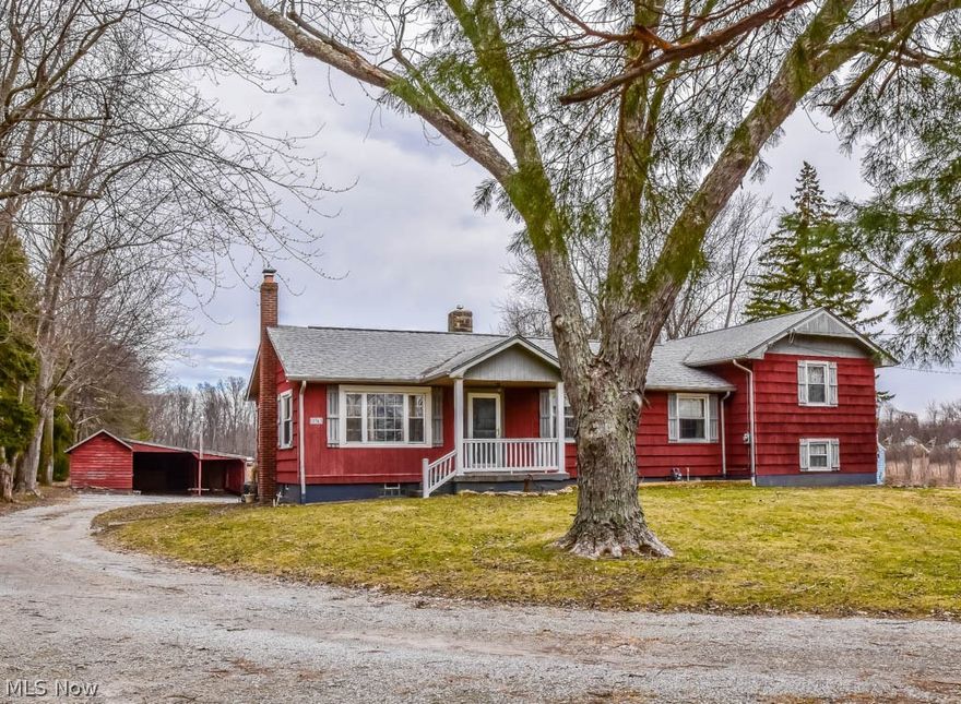 Fantastic find! Filled with possibilities, this 3 bedroom, 1.5 bath split level sits on 3.27 acres in Marlington Schools! Step into the spacious living room featuring a wood burning stove and a picture window. The eat-in kitchen is large and offers a broom closet, dinette and serving window to the dining room - this opens the space and allows for easy entertainment. There's a nice bonus area off of the dining room, perfect for a first floor office or mud room. The master suite is very private! Situated on its own level, it has 2 closets, a half bath and beautiful laminate flooring. There are 2 additional bedrooms and a full bath with extended vanity. Relax on the 17x11 deck overlooking the deep backyard! There's a fenced area off of the deck perfect for pets and a tack room with a 2-car carport and a small stable with access to a separate fenced-in area. Don't miss out - call today to schedule a private showing!