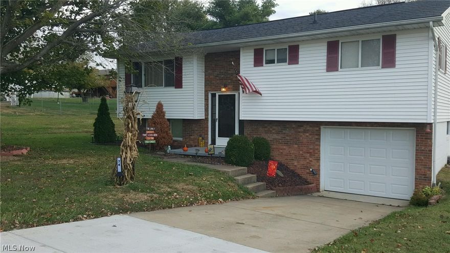 Plenty of natural light.  New carpet & paint in living room.  New six panel doors throughout home.  Hardwood floors in bedrooms.  Modern color scheme!  Updated everything. A home you'd be proud to own.  New heating and AC. Brand new garage door. Call to see this beautiful home!