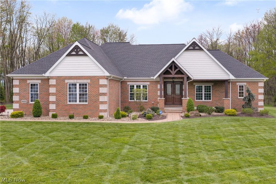 This one-owner, custom-built brick ranch by TriDoc Homes offers a rare opportunity to own a truly upgraded, move-in-ready luxury home. Meticulously maintained & extensively improved, owner has invested hundreds of thousands of dollars in enhancements, making this property truly better than new. Situated on a quiet dead-end street surrounded by million-dollar homes.  From the moment you arrive, the paver-lined concrete driveway & professionally designed landscaping create a striking first impression that reflects the quality found throughout. Side entrance 3 car heated garage w/ access to lower level. Immaculate landscaping leads to covered front porch entrance. Backyard offers unique heated dog/kennel w/ pet friendly fully fenced in pet AstroTurf. Kennel could be used as storage or a he/she shed. Inside feel the warmth of natural cherry wood crown molding throughout. Stunning high end cherry hardwood flooring and 9ft ceilings throughout. Great room has cathedral ceilings w/ full wall stone woodburning fireplace w/ insert and custom mantel. Open concept to chef's gourmet eat in kitchen offering granite counters, Dutchcreek cabinetry, AMAZING double door Frigidaire Professional refrigerator and matching stainless steel appliances. Formal dining area also can be sitting/living room. Master bedroom w/ coffered ceiling & luxury ensuite w/ beautiful porcelain tile, two vanities and custom walk-in shower. Office w/ French doors & closet could be 4th bedroom. 2 additional bedrooms w/ Jack & Jill bath. 1st floor laundry room w/ new washer & dryer. Sliders off of kitchen to new Patio Enclosure w/ heating & cooling. Home features custom remote/cell phone controlled blinds. Full 9ft poured foundation basement w/ 225 amp wiring with Pentair Intellidrive water pressure control center. Minutes to highway access and shopping. Could not build this home today with the improvements for this price and lightly used over the years - truly better than new!