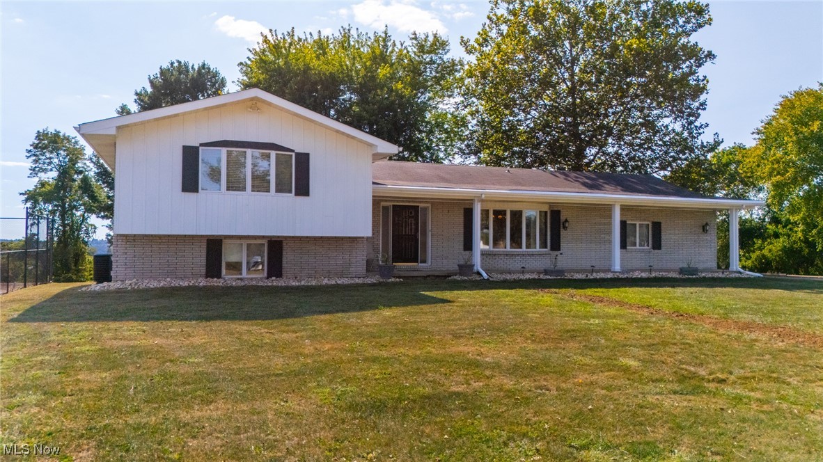 Here's a hidden gem with a scenic panorama of the hills and valleys from the rear deck and back yard. Located on a hilltop and a single lane paved road in the Bridgeport school district, this 3 bedroom - three full bath home is situated on a 2.23 acre FLAT lot! If outside entertainment is your game. this home features a covered rear deck measuring 13' x 33' AND a 12' x 26' concrete patio with a firepit!