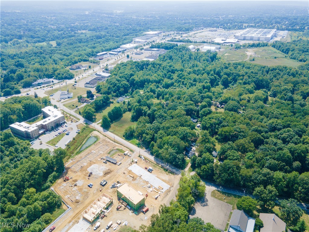 ABSOLUTE ONLINE AUCTION, Begins Ending 09/30/2025 at 6:00 PM, Parcel 3 | Here’s a rare opportunity to acquire prime commercial property in Akron, OH, just minutes from the Amazon Fulfillment Center and surrounded by new apartments and mixed-use development. The property offers excellent visibility along Romig Road and Vernon Odom Boulevard in a growing retail corridor anchored by Aldi and other national retailers.
Parcel 1: Six-unit commercial building on 3.686 acres, including ~1 acre of wooded land with harvestable timber. Three access points—two on Romig Road with 290 feet of frontage and one on Vernon Odom with 45.57 feet. The building has a mix of tenants and vacancies. The anchor space, previously leased for $7,000/month plus utilities, is vacant and available. Two units are leased at $1,000/month each. When fully occupied, the building can generate $10,000+/month. Units share one water meter; each has separate gas and electric. Upgrades include a 2024 AC unit and water heater in unit 2066. Zoned UPD-15.
Parcel 2: 1.065-acre vacant lot with 57.83 feet of frontage on Vernon Odom. Development-ready, zoned UPD-15, suitable for commercial, retail, or mixed-use.
Parcel 3: 1.043 acres with 103 feet of frontage on Vernon Odom and 30 feet on Marietta Avenue. Vacant, partially wooded, and zoned primarily UPD-15, with part under U-1 Single-Family, allowing flexibility for mixed-use.
Together, these parcels combine rental income with strong upside through re-tenanting, redevelopment, or new construction. Investors may bid on the commercial building, one or both lots, or the entire package. A unique chance to acquire income, acreage, and development land in a rapidly expanding Akron corridor.