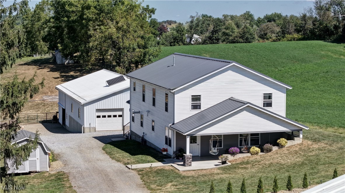 This is a real estate auction on Tuesday, September 30 at 6 PM!! What an opportunity to own a beautiful 4 bedroom, 2 bathroom home on 2.92 acres located centrally between Mt. Hope, Fredericksburg, and Mt. Eaton, in a highly desirable area. This well-maintained two-story home was built in 2019 and features 2880 sq ft of modern comfort, efficiency, and plenty of space to enjoy country living. Step inside to an inviting large open concept hickory kitchen, dining room, and living room, perfect for entertaining. Back the hall is a full bath, storage room, and spacious utility/laundry room with access to the back porch. Upstairs, you’ll find four generously sized bedrooms, a full bathroom with laundry chute, sewing room, and storage room. Enjoy warmth and efficiency having in floor heating on both levels, solar system, natural gas, well and septic. Quality outbuildings include the 31’x40’ 2 story barn with lower level offers 3 box stalls with possibility of 6 stalls, upstairs for hay loft or abundant storage, and 33’x40’ shop (currently woodshop), 14’x16’ insulated motor building, storage barn, and chicken coop. Don’t miss this chance to own a quality home, functional outbuildings, and great mix of open pastureland with some walnut trees and plenty of space for livestock or equipment on 2.92 acres in a prime location. Make your plans to buy this property.