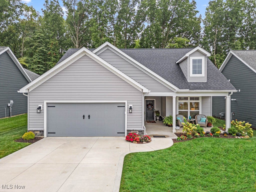 Tucked in the Courtyards at New Seasons 55+ community, this impeccably cared for Charis built home features the sought after Torino floorplan on a prime lot with secluded wooded views. Built in 2022, it offers 3 bedrooms, 3 full baths, and is ADA compliant with thoughtful upgrades throughout. Inside, 9' ceilings on the main level create an open, airy feel that makes it easy to enjoy daily living and entertaining. The kitchen is designed with Amish maple soft close cabinetry, granite countertops, an oversized island with breakfast bar, tile backsplash, stainless steel appliances, and plenty of storage. It flows into the dining area surrounded by windows and the great room where everyone can gather. Just off the great room is a versatile home office, providing a quiet place to work or manage daily tasks. Two bedrooms and two full baths are on the main floor, including the primary suite with a walk in closet and private bath with dual sinks. A spacious laundry room with a utility sink sits conveniently inside the entry from the 2 car garage which includes a 40 amp EV charger. Upstairs, you’ll find a comfortable family room, third bedroom, and full bath, perfect for guests or an additional spot to relax and unwind. Step outside to a wonderful outdoor retreat with a screened porch and extended patio, both overlooking the wooded backdrop. It’s an ideal spot for morning coffee, quiet afternoons, or gathering with friends and family. When it’s time to head back inside, you’ll appreciate the energy efficient upgrades including dual A/C controls, a 95% efficient furnace and A/C, Jeld Wen double hung windows, and a 50 gallon hot water tank. Resort style community amenities include a clubhouse with kitchenette, swimming pool, fitness center, party center, and pond with walking path making it easy to stay active and connected. With its prime location, upgrades galore, and welcoming feel, this home has so much to offer. Call to schedule your personal tour today!
