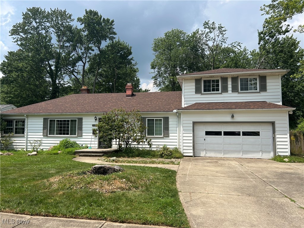 This home has so much potential but needs some cosmetic TLC to make it your own. This handyman special has a lot of space over 2400 square feet with 5 bedrooms, 2 and a half baths and a master suite with private bath and large closet which is unique for its time. Spacious living room with wood burning fireplace opens to the kitchen area. The enclosed indoor patio area is unique as well. The first floor laundry room with additional storage space is a plus as well as two additional bedrooms on the first floor and two more upstairs make this home very spacious. Plenty of parking with the 2-car attached garage, driveway and extra parking spot next to the garage. Located on a large corner lot and private backyard this home has so much potential. Updates include New Roof in 2023, Furnace and AC in 2018, also some new windows in 2018. Do not miss your opportunity to see this home! Location is conveniently located by shopping, restaurants, freeway access, parks and more. Sold As Is.