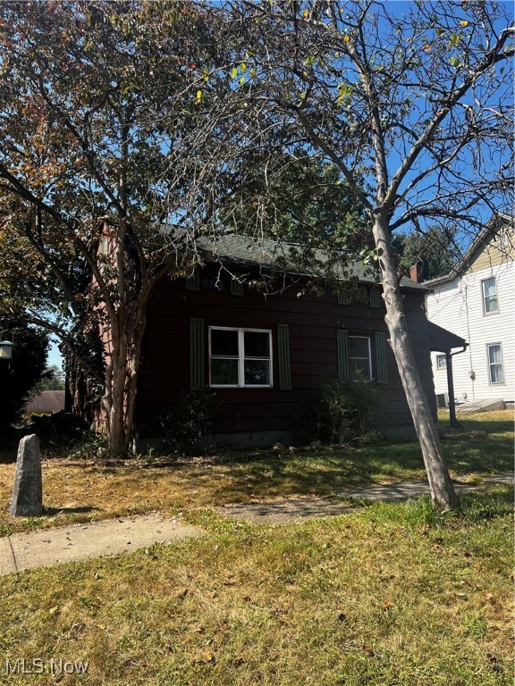 records show it built in 1880, and originally a log cabin, this may be one of the oldest homes in Canal Fulton. The outside has been redone but the inside has the charm of the cabin intact. Many modern updates have been done - new roof 6yrs ago, HVAC 4 yrs ago, city utilities. Current owners began a remodel but life intervened and it remains unfinished. Huge back yard! Bring your tools and get this home restored to its former glory.