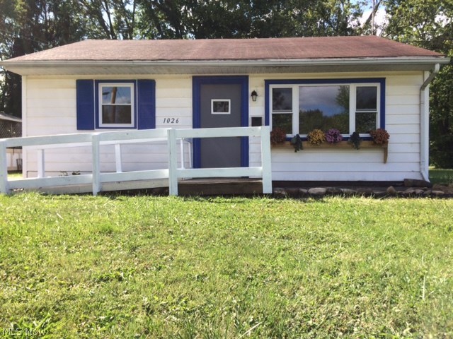 Join the trend and get your very own tiny home! This absolutely adorable 2 bedroom, 1 bathroom home is full of character and charm. When you walk in the front door you will see the brand new, no maintenance vinyl flooring that looks just like real wood! The living room is nice and bright with the sun shining through the new windows. You will fall in love with the kitchen cabinets and just installed tile backsplash. The countertops, sink and faucet are all new as well. Kitchen comes equipped with an electric range and refrigerator. The hallway off of the living rooms leads to 2 bedrooms with nice closets, a hall closet and the bathroom. The modern colors, all new tile work, new vanity and medicine cabinet make this bathroom gorgeous. There is also a floor to ceiling linen closet in the bathroom as well. No need to climb the stairs to do your laundry, the convenient first floor laundry and utility room makes life simple. New hot water tank, lots of extra storage and the washer