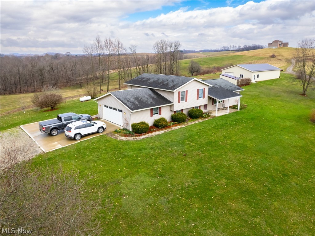 Auction 5/12/22. Great Home and Shop. on 5 acres. The Home has an updated Oak Kitchen w/newer appliance, Formal Dining Room, Large Living Room, and a ½ Bath on the main level, with the Master Suite and 2 more Bedrooms and Bath up, as well as lower-level Family Room, ¾ Bath, Laundry/Sewing area. The Basement has Utility and storage area and can cellar. There is a Great back Patio and an attached 2 Car Garage. There are 2 heat sources-propane heat pump, and an Outdoor wood furnace. The 32x72 Shop has a heated area as well.