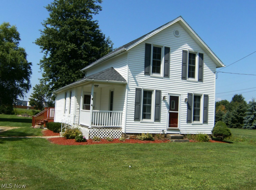 Wonderful acre property. Beautiful kitchen with pantry, built in desk, ceramic floor and all appliances. Separate dining room, living room, three bedrooms, 2 full bath, all updated, first floor laundry, neutral decor, side porch and deck, newer windows, air 32x48 outbuilding. Country but close to all city conveniences.