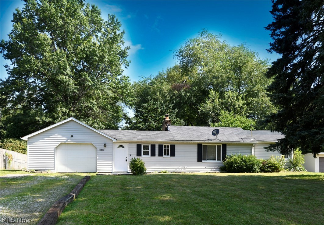 Don't miss your opportunity to make this updated ranch with a great lot in the desirable Jackson TWP YOURS! The lot is over half an acre and gorgeous! It is fully fenced in, has a basketball court and an adorable treehouse. On rainy days, you can still enjoy the backyard view in the quiet and peaceful enclosed breezeway and on sunny days sit out on the concrete patio! Walk in the front door to a beautiful updated living room with laminate flooring, a gas fireplace and fresh paint! The kitchen has freshly painted cabinets, amazing vaulted ceilings, and plenty of counter space and storage. Down the hall is the first floor laundry, a large full bathroom and 3 bedrooms. In the bathroom are 2 linen closets with lots of storage and a newer surround! In the first bedroom are 2 nice sized closets , vaulted ceilings and a ceiling fan. The freshly painted master bedroom has so much closet space and a door that leads to the backyard that would be perfect for a deck to enjoy your morning coffee!