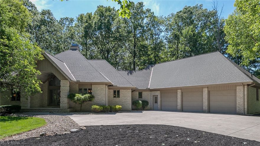 This beautiful custom built brick ranch is situated on a wooded lot.  The expansive home sits back from the street on nearly an acre.  Enjoy your family and friends in the kitchen and great room - a perfect gathering space.   Kitchen is equipped with new appliances and new granite countertops, featuring an island and breakfast bar, along with custom built cabinets.  The great room features vaulted ceiling, fireplace, and wall of windows overlooking deck, patio, and treed back yard.  The master bedroom features vaulted ceiling, walk-in closet, and large master bathroom.  All bedrooms have private baths with custom built cabinets.  Family room features office area with custom built cabinet showcase.  Oversized 3.5 car heated garage with epoxy floor.  Also, full basement and walk up attic that could be converted into fourth bedroom.   Located within minutes to luxury shopping, golf courses, recreation center, Metroparks, and hospital in beautiful Westlake Ohio!