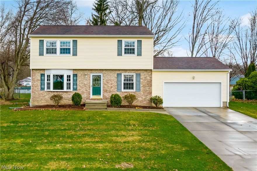 Welcome home to this 4 bedroom colonial located in Brimfield Township!  Move-in ready and waiting for it’s new owner.  The kitchen is beautifully updated with granite countertops, travertine tile back splash, stainless steel appliances, and giant custom built cabinets extending all the way up to the ceiling.  The built in pantry and many of the cabinets contain convenient roll out drawers.  The large living room features hardwood floors and large bay window, with sliding glass door that leads to the backyard.  Upstairs you will find 4 spacious bedrooms and main bath with solid cherry cabinets and solid surface counter/shower surround.  The finished basement has glass block windows and is set up for a workshop or can easily be used as a rec room instead.  The backyard is almost entirely fenced in aside from the front sides, and includes a huge wooden deck with large awning.  Large vinyl sided shed is perfect for storage.  Other updates include:  HVAC (2009), H20 Tank (installed 2014), a