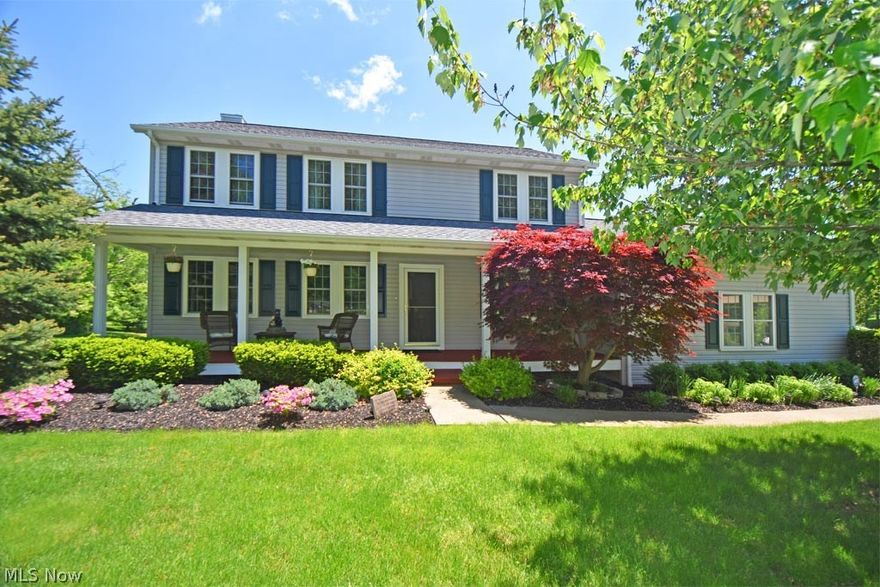 Better hurry with this one. Rarely does a home come on the market in this price range which has been extensively and meticulously updated – from top to bottom, both inside and out. Gorgeous and inviting front-porch colonial on 2 usable & private acres. Serene, pristine, attention to detail, quality materials, and timeless design. Traditional yet comfortable, the main level has both a formal living & dining room, an eat-in kitchen w/solid surface counters, tile backsplash w/under cabinet lighting, ceramic floors, newer appliances, & a separate command/desk area. Comfortable family room w/a gas log fireplace, stone surround & granite hearth. The upstairs features a cozy master bedroom w/a renovated master bath & walk-in closet w/organizer shelving. 3 other bedrooms share a renovated hall bath. Fin recreation room finished by Ohio Basement Systems & the unfinished area is beyond pristine and walks out to the stone patio. Unlike many properties, this backyard is completely usable, level &