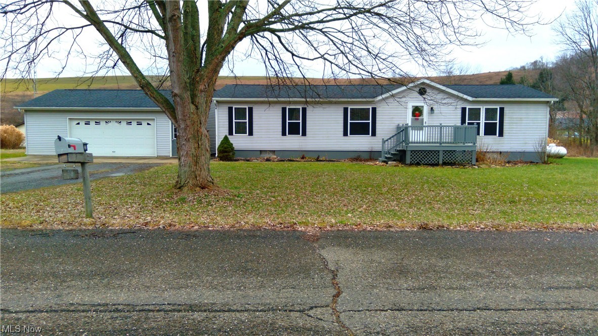 Wide open spaces for quiet country living minutes from New Philadelphia! This 3 bedroom home is move-in ready and conveniently located just outside of town on 1.54 sprawling acres. Close to highway access. Property boasts a detached 2 stall car 24x32 garage. Open concept living makes this home great for entertaining. Two full bathrooms, a laundry room and all the bedrooms are on the main floor. The large primary bedroom has a full attached primary bathroom with a garden tub and shower.There is a large living room and office in the basement and the remaining 25x40 space has unlimited possibilities! The basement is clean and is ready for storage and to make additional rooms. This property is located at the end of a paved road and is perfect for easy country living. 22X60 garage.