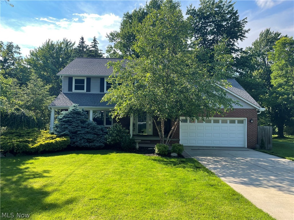 This spacious colonial positioned off of Mentor Avenue is located on almost an acre of wooded property. All appliances including the hot tub out back and the extra fridge downstairs are included. Smart Home connected to Nest which includes thermostat, doorbell, smoke & CO2 detectors. ADT security system also included. The kitchen overlooks a roomy living room with a beautiful brick gas fireplace. Half bath on the main floor has a washer and dryer hookup. Washer and dryer hook ups can also be found in the basement. The basement is massive and has it's own workshop. Upstairs bathroom was just renovated and updated June of 2021. Beautiful bamboo and hardwood flooring covers the majority of the home. Most light fixtures have been updated. This home really is a beauty. Questions on appliances & added bonuses; please see Home Fact Sheet under Supplements.