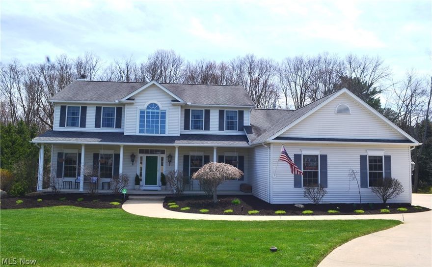 Fabulous updated colonial, built by Schumacher, highlights 4 to 5 bedrooms and 4 full baths.  Welcoming covered front porch leads to the two story foyer with views of the rooms beyond.  Formal living and dining rooms offer bright light and neutral decor.  Spacious kitchen presents Brazilian cherry hardwood floors, cherry cabinetry, granite countertops, stainless steel appliances, and access to deck.  Engaging  great room features mantled gas fireplace and opens to sunroom with cathedral ceiling that overlooks private pool area and woods w/creek.  Large laundry room, office/bedroom, and full bath complete the first floor.   Vaulted master suite with glamour bath and Jacuzzi tub.  Newly finished lower level walk out with family/media room, bedroom, full bath, and French doors to outdoor covered patio with weatherproof decking overhead. Quality throughout.  3 car side garage.  Above ground pool.  Picturesque views of wooded lot.  Excellent location on private cul-de-sac road. Move-in ready!!