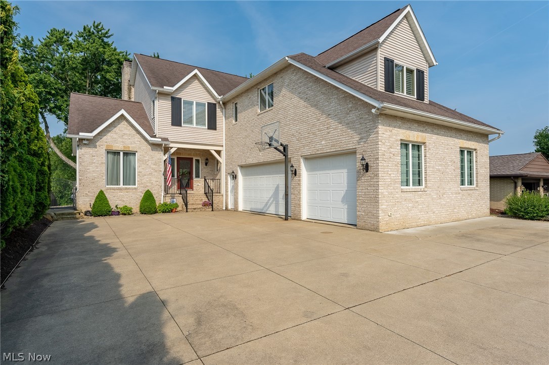 Fabulous opportunity to live at Lake Cable waterfront! You will feel like you are in your own private paradise with access to 150 acres of lake, sunsets, entertainment and relaxation. Enjoy gorgeous views, landscaping, a great patio, deck, firepit area and private dock. Come in and experience for yourself! Inside you will find a nice open floor plan and enter into a 2 story great room with double stacked windows overlooking beautiful landscaping and water views. Tons of natural light pouring in. 3 generous sized bedrooms and 4.5 baths. 3 levels of living with a walkout lower level. Large 30x16 kitchen eat-in area with Cambria Quartz countertops and maple cabinets. Awesome master bedroom with a balcony overlooking the water. This is a perfect spot for entertaining and relaxing! It's your own private sanctuary tucked away on the lake while still convenient to everything. When navigating to the property, input 5600 Island Dr NW Canton OH 44718, using 5600 North Island Dr will take you to
