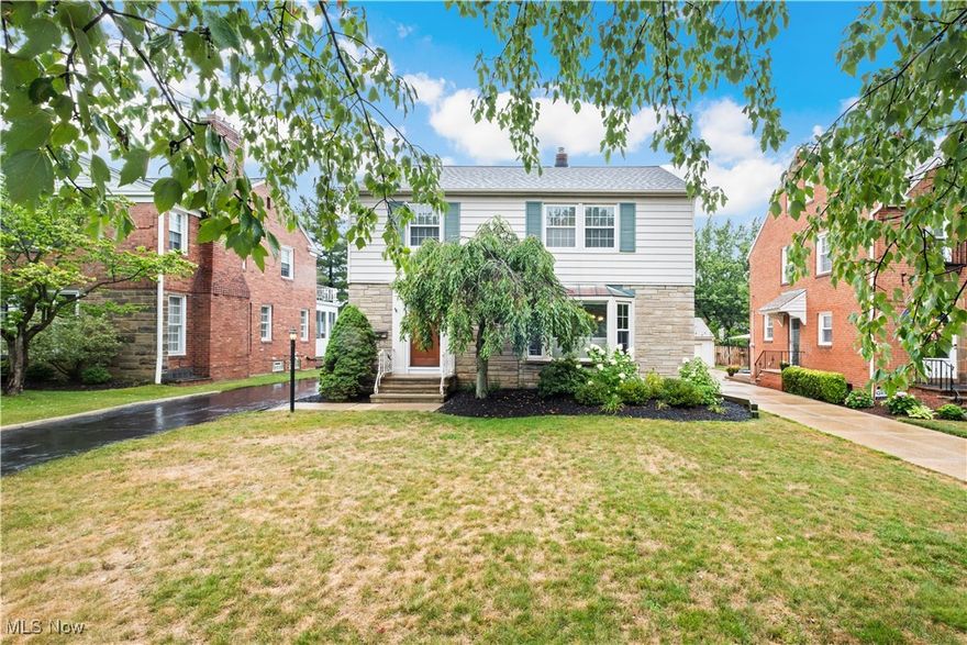 BESIDES STYLE, AND CHARM, this colonial has 3 bedrooms and great living space in an EXCELLENT University Heights location. 
When you enter this warm spacious home through the front door and foyer, you will enter the living room with wonderful natural light from the bay window area. The fireplace adds to the warmth and charm in this room. The luxury vinyl flooring on the first floor leads you to the formal dining room area that has a breakfast bar looking into the eat in kitchen.  The kitchen boasts hardwood flooring, beautiful white cabinets, stainless appliances and a nice eat in area over looking the back yard. The kitchen leads you to the side door entrance and desirable first floor laundry room. (Washer/dryer will stay). 
This home also features a four season room/second family room with built in bookcase. This area has access to the newer composite deck 13x11. 
Second floor offers 3 spacious bedrooms, plenty of closet space with an additional walk in closet off of the hall for additional storage. All the bedrooms have overhead lighting and ceiling fans. 
The basement has a large finished recreation room that has newer carpeting and glass block windows for bright natural light. 
This location is walking distance to John Carroll University, cultural activities, trendy restaurants and more. The home is City POS compliant. Fully fenced in yard, newer roof, deck, vinyl windows, basement carpet, garage door and siding are newer. 
Two car detached garage newer siding & door in 2020. Home warranty included.