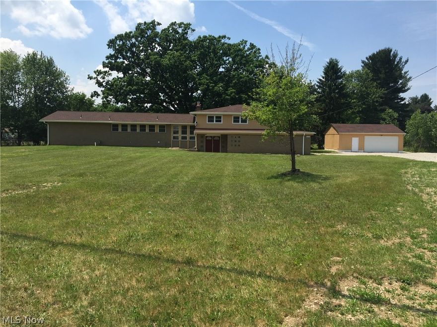 Don't be fooled by the outside, complete remodeled interior! 4 level totally renovated sprawling split with 2 master suites!! 4 additional bedrooms. Gourmet kitchen open to great room, stainless appliances granite counter. Great room, dining room and master with vaulted ceilings. New furnace and AC, roof, gas line, plumbing, electrical,  bathrooms, carpeting, windows. Deck off both master suites. Full finished basement, fireplaces in great room and in family room!! Lots of room for everyone! Extra large 29x20 garage plus an additional 2 car detached garage perfect for a car buff. Great 1.63 private yard. Please see supplements for plot map.