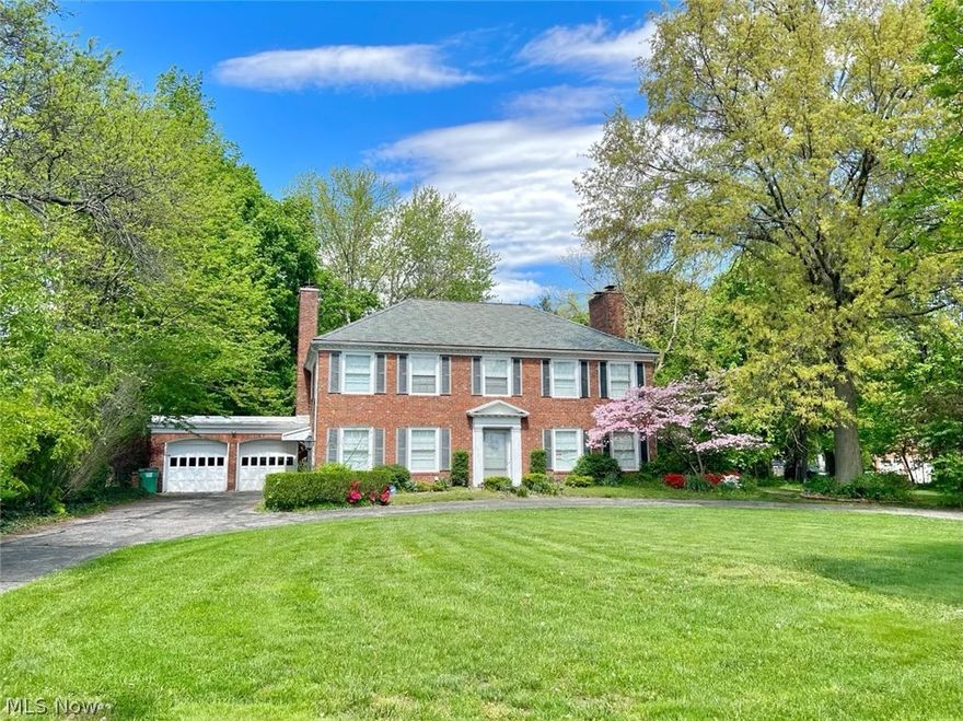 Welcome to this Stately Center Hall All Brick Georgian Colonial, That features 4 bedrooms 3.5 baths and bonus room/office/nursery, and 2 three season rooms, on the first and second floor. This home was built in 1932 when quality and craftsmanship meant everything. The slate roof is 92 yrs old and ready for the next 92. The home features high ceilings with custom crown molding in every room. There's plenty of unique crafted woodwork throughout, chair rails and wainscoting and French doors and family room/library with built-in bookshelves. Two staircases to second floor, main hall staircase and circular stairway off of kitchen. Huge yard for family get togethers 1.48 acres. Also a large fenced in area off the kitchen that is perfect for pets. Huge walk up attic with hardwood floors and ample storage. The 2 car garage with attached shed/workshop and convenient pass through to the back yard. The full basement also has a workshop and a rec room w/wood burning fireplace, and laundry room with chutes from upper levels. Call your agent today to get a look at this Very Unique Home!