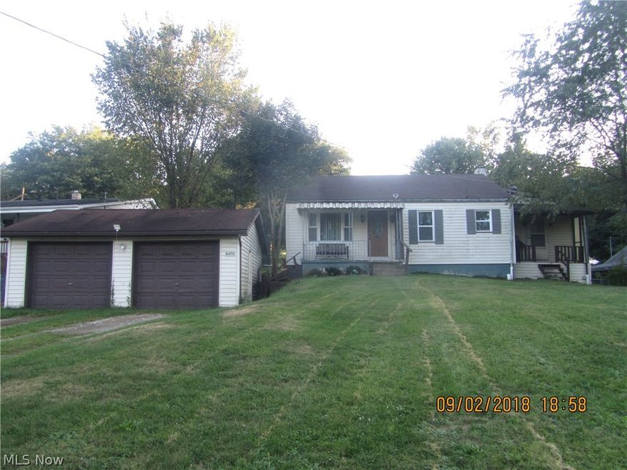 Major remodel on this vinyl sided single story home just five years ago. Updates included new kitchen with stove and refrigerator, laminate flooring throughout, new 200 amp electric service and new high efficiency hot water circulating furnace.  At that time the laundry was moved to the main floor and updates done to the bathroom including tile floor. Dry walk out basement and 24' x 24' detached garage. Fiberglass front entry door, Two covered porches and a sun deck in the back.