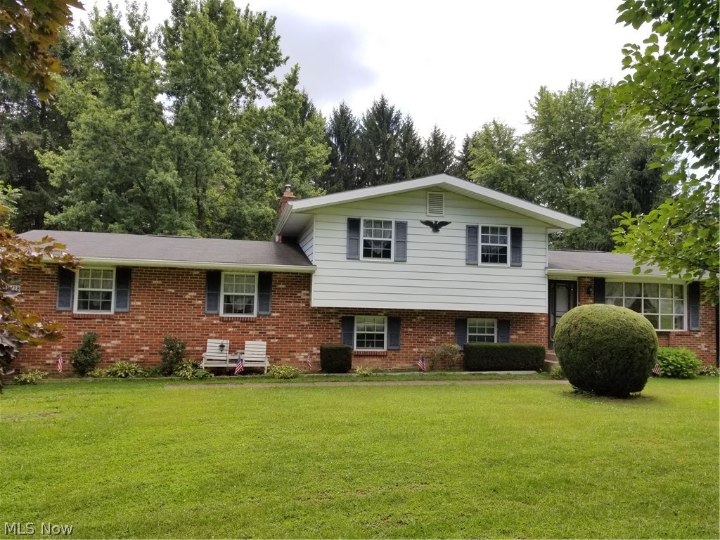 4 Level Split - Formal Living Room with bay window, Dining area with sliding doors to rear deck, & Kitchen on main level. 3 bedrooms & full bath (tub/shower) on upper level. Lower level has Family Room with brick fireplace (wood burner), Office & full bath (shower stall). 2 car garage, shed, & deck! Selling "AS-IS"/ estate.