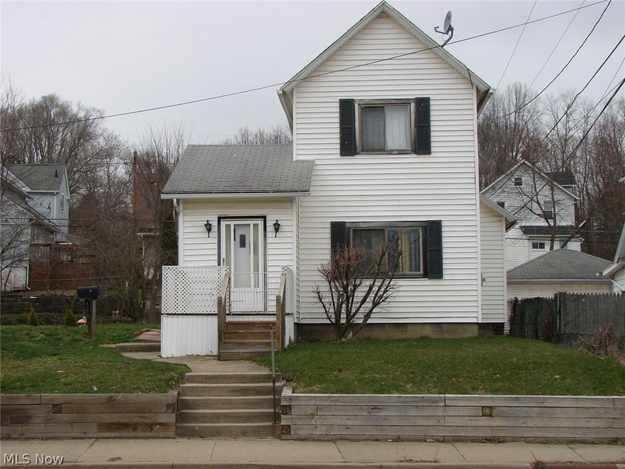 Charming 3 bedroom, 1 bath Colonial in the Heart of Barberton.  Spacious Kitchen that leads to the Large Dining Room and enters into a Cozy Living Room, Master Bedroom and Full Bath on the Main Floor.  2 Bedrooms upstairs.  Original Trim, Stunning Archways, Solid Wood Doors.  So much Character!!!  Basement is clean, dry and well Maintained.  Sellers Comments:  "We Love the Original Wood, the Open Floor Plan, Archways and Yard Space.  We also enjoy that we are only 1 mile from the Hospital, High School, Local Park and the Expressway."  All new Plumbing, New Retaining Wall, Gravel Drive Way, Green Board Wall Installed in Shower and Attic Insulated.  Electric Panel -2014, H2O - 2015.
