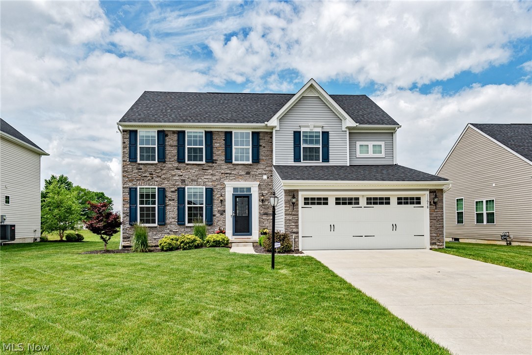 Move right in to this picture perfect colonial in Columbia Station! With over 2,900 square feet of living space, a welcoming floorplan, and tasteful decor throughout, this home is just waiting for a new owner! Gorgeous hardwood floors greet you in the foyer and flow into the formal dining room. You will absolutely love the kitchen, which includes stainless steel appliances, an oversized island, glass tile backsplash, and a stunning eat-in area with a wall of windows that frame the backyard. Off of the kitchen, you'll find a spacious living room and a lovely sun porch. A half bathroom, a mudroom, and an office complete the first floor. Upstairs, you will find four spacious bedrooms and two bathrooms, including the owner's suite. The owner's suite includes a large bedroom, two walk-in closets, and a lovely en-suite bath with a step-in shower. The full lower level is nicely finished with a spacious rec room and a full bathroom, ideal for game night! Outside, there is a lovely back patio t