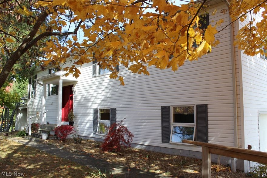 This large Raised Ranch style home is located on the WATER in Holiday Lakes. Enjoy the convenient access to the water directly from your own picturesque backyard. Swimming, boating, fishing and restaurant are all available right in the Holiday Lakes community. Enjoy the view of the water from the large deck off of the dining room. This home has 4 bedrooms, 2 full baths and main floor laundry space. There is a complete living space in the lower level with a family room(has wood burning fireplace), a bedroom, full bath and a fully applianced kitchenette. This lower level living space is great additional space to provide your overnight guests with private accommodations. The enclosed area(unheated) under the deck offers additional storage when it's time to put away all of your outdoor furniture.