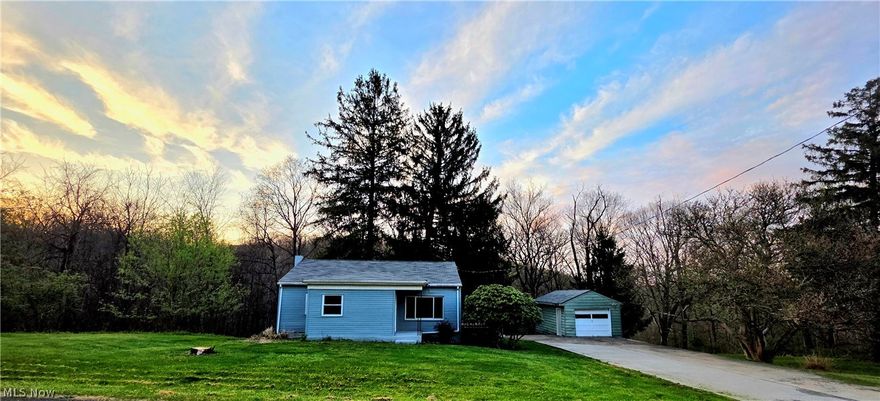 BACK ON THE MARKET AT NO FAULT OF THE PROPERTY. Welcome to this beautifully renovated 3-bedroom home set on 1.74 acres offering modern updates, generous space, and a peaceful setting. The main level features 1,140 sq. ft. of living space and showcases an extensive list of updates, including a new roof, new windows, new electric wire at service entrance, new 200-amp breaker box, all new wiring, new drywall and insulation, new entry doors, and new flooring throughout. Any original hardwood flooring has been professionally refinished to seamlessly match the newer flooring, creating a cohesive and inviting feel. The kitchen featuring a breakfast bar has been fully updated with new cabinetry and opens to a newer deck, perfect for outdoor dining or entertaining. A bright and welcoming living room is highlighted by a large picture window, filling the space with natural light. The upstairs bathroom has been completely renovated, and the basement houses the second bathroom with sink new toilet and a shower. The full basement has been freshly painted throughout and offers a true blank canvas—ideal for future finishing as a family room, recreation space, home gym, or additional living area. The basement also features walk-out access to the backyard, adding functionality and flexibility.
Outside, the property offers a mix of open yard space and wooded, sloped terrain. The grounds are enhanced by mature flowering trees, including a large magnolia & well-established rhododendron. A one-car garage is located just beyond the main yard area. Due to cold weather conditions, garage was not painted; however, the seller is willing to provide paint with an acceptable offer. Also, with an acceptable offer (per seller discretion) there is a Cub cadet riding mower that would be included in the sale. This thoughtfully updated home combines modern improvements with scenic outdoor space and offers endless potential both inside and out.