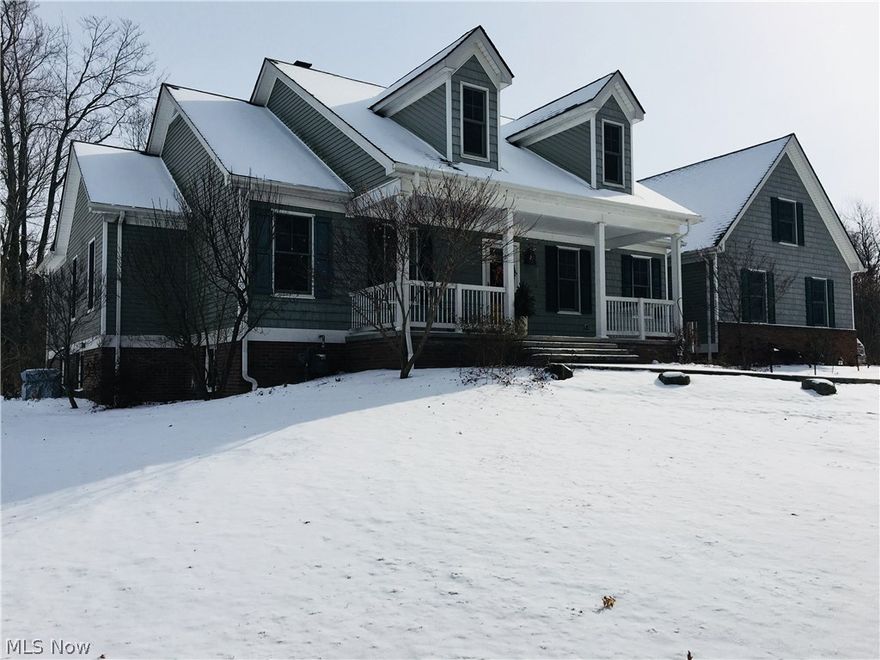 Country living at its finest! This immaculate, one-owner, custom ranch home sits on a beautiful 2.5 acre lot in Hiram's Hidden Hill Estates development. The home features a spacious open floor plan with hardwood floors in the foyer, great room, kitchen, dining room, third bedroom and hallways, 9-foot ceilings throughout, a large and welcoming front porch, and a sprawling rear deck with multiple points of access. The kitchen is designed for beauty and efficiency, with a full suite of stainless appliances, plenty of custom cherry cabinetry, and a gorgeous center island with granite top. The kitchen flows into the spacious open dining room with large, rear bay windows. The centerpiece of this remarkable design is a stunning great room with a towering vaulted ceiling and a brick Rumford fireplace, popular for its classic design and high efficiency. Sophisticated glass doors and matching adjacent glass panels allow convenient access to the deck and offer an expansive view of the densely woo