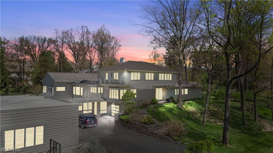 Welcome to 19601 North Park Blvd! Offered at $2,300,000, this exquisite residence includes 5 bedrooms and 7 bathrooms. Perched above majestic North Park Boulevard, the home offers unparalleled vistas from every room. Designed to seamlessly integrate indoor living spaces with nature, the home gives a sense of tranquility amidst nature and the beautiful simple clean lines of mid-century architecture. A harmonious blend of layered and textured materials, complemented by sleek, modern lines, imbues the home with a subtle sense of warmth and fluidity. Reimagined and redesigned by famed architect John Williams, over $3,000,000 was invested to make this property truly one of a kind. Boasting over 8000 sq ft of total finished living space, the house features an amazing studio/media space with a full kitchen, full bathroom and its own terrace and entrance. Other features include a chef's industrial grade kitchen, a first-floor primary suite with a glamour bathroom and a walk-in closet, a home gym, wine cellar, 4 car heated garage, formal living room and dining room, a large 36x17' family room with its own kitchenette area and vaulted ceilings.  Every detail of this property has been meticulously crafted to elevate the living experience. Call now for a private showing.